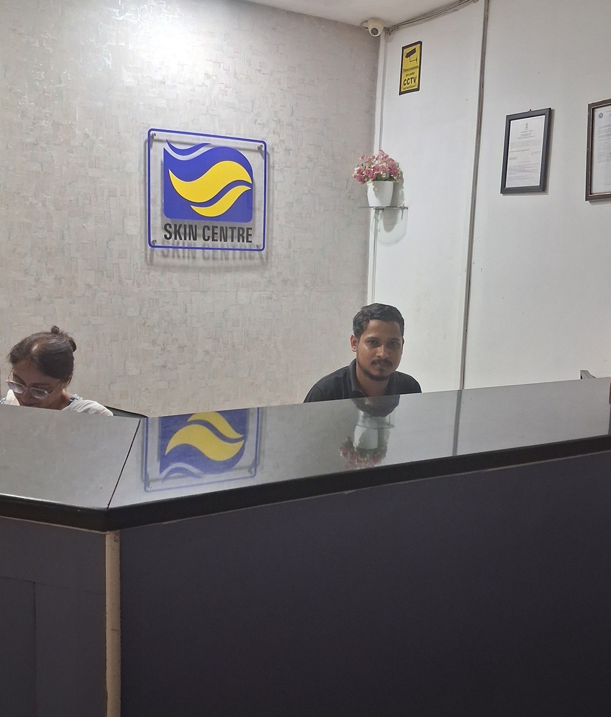 Best dermatologist in Guwahati examining a patient's skin at SKIN CENTRE clinic in Bhangagarh